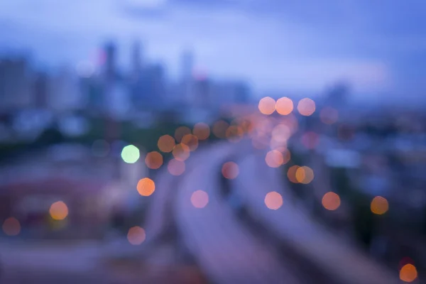 Neon light highway over cityscape — Stock Photo, Image
