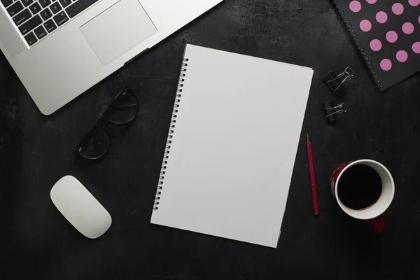 Wooden black office desk with laptop — Stock Photo, Image