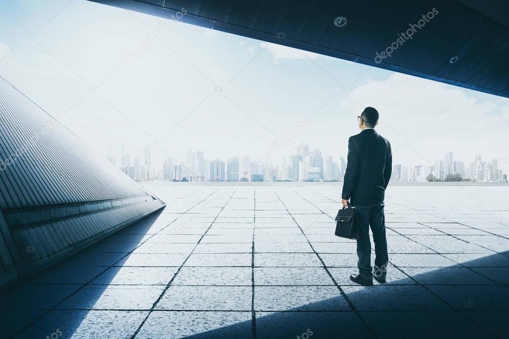 Businessman on roof top balcony