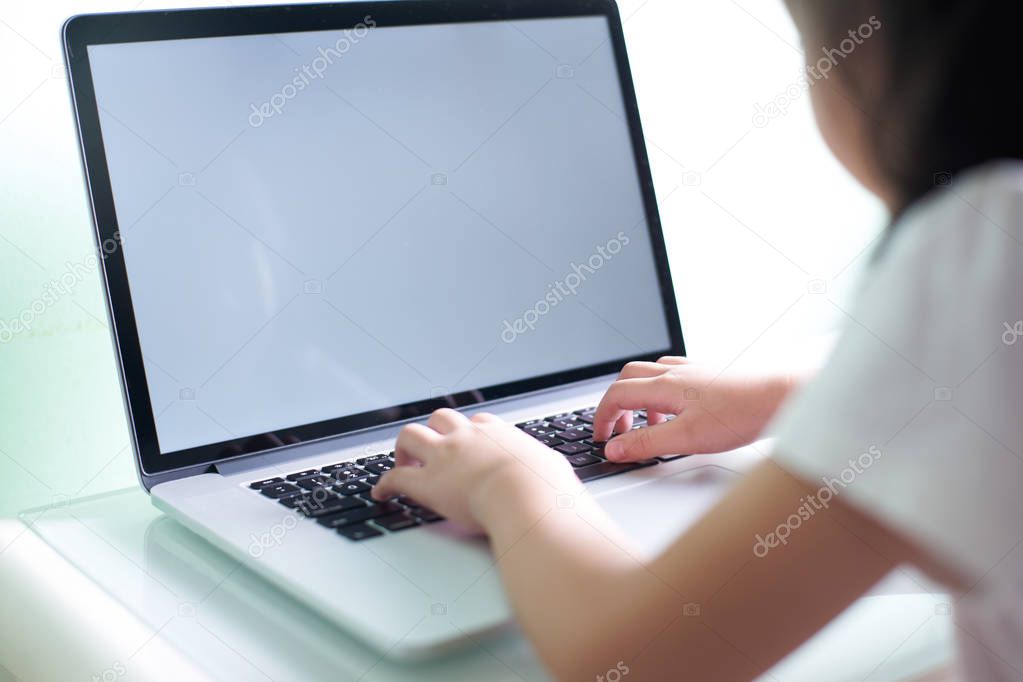 Kid using laptop 