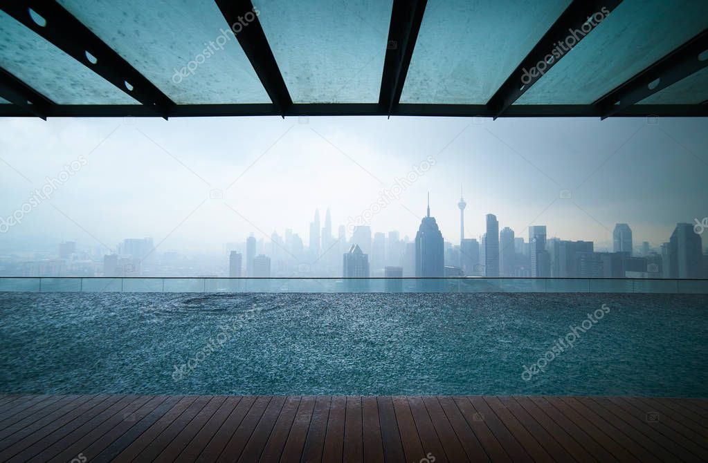 Swimming pool on roof top in city