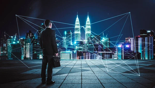 Businessman at city center with network — Stock Photo, Image