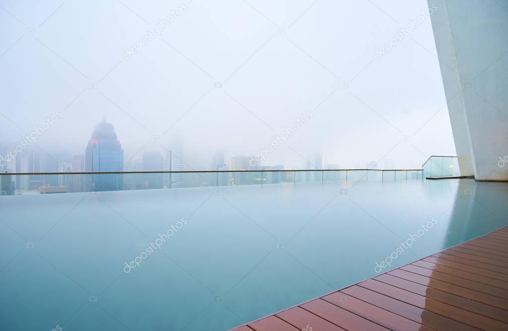 Swimming pool on roof top in city