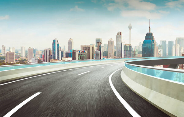 Highway overpass motion blur effect with modern city skyline background
