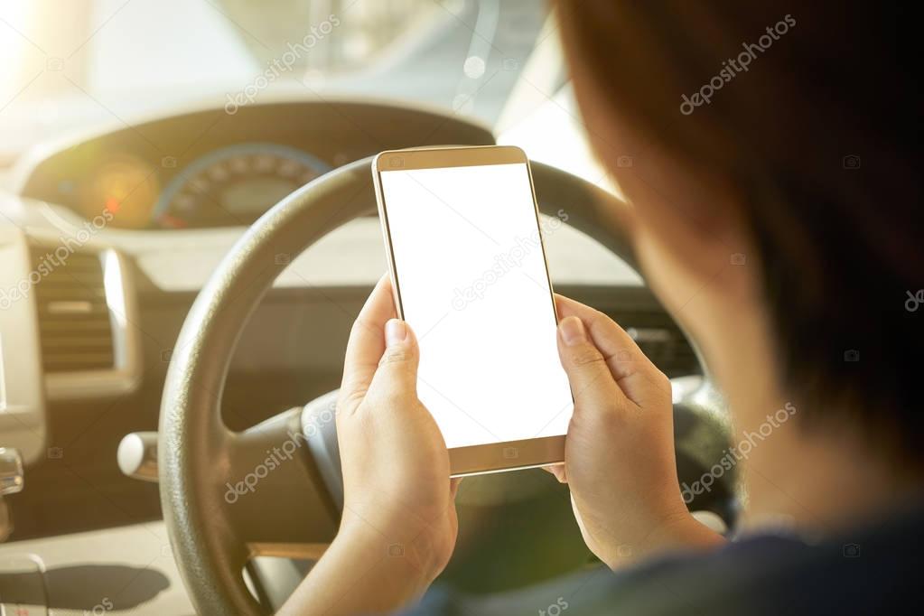 female driver using smartphone