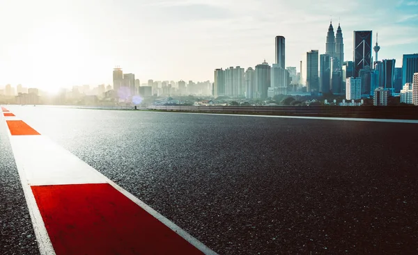 Racetrack with red and white safety sidelin — Stock Photo, Image