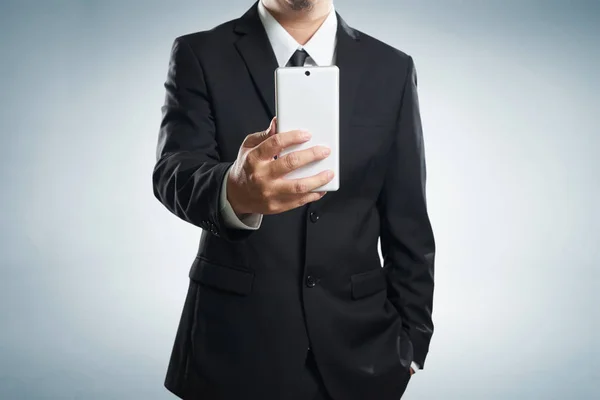 Businessman in black suit taking selfie selfie — Stock Photo, Image