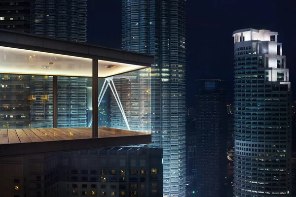 Modern sky office by night with beautiful city skyline view .