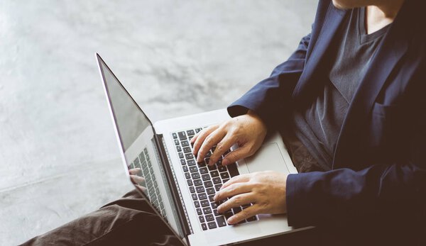 Top angle and closeup view  of businessman using the laptop .