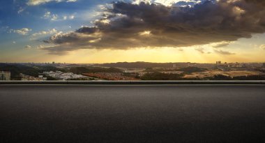 Panoramic view of asphalt road side with dramatic blue and orange color cloudy sunset golden hour . clipart
