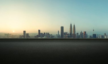 Asphalt empty road side with  Kuala Lumpur city skyline background. Sunrise scene clipart