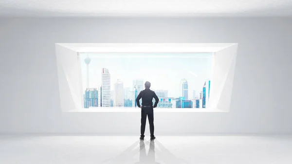 男子站在白色的房间 明亮的窗口和城市的看法 — 图库照片