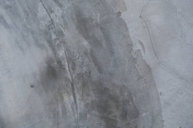 Çatlak desenli gri çimento ve beton duvar .