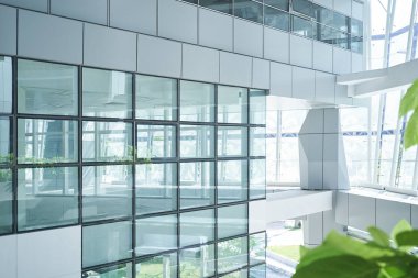 New modern empty unrenovated office buildings with glass wall . clipart