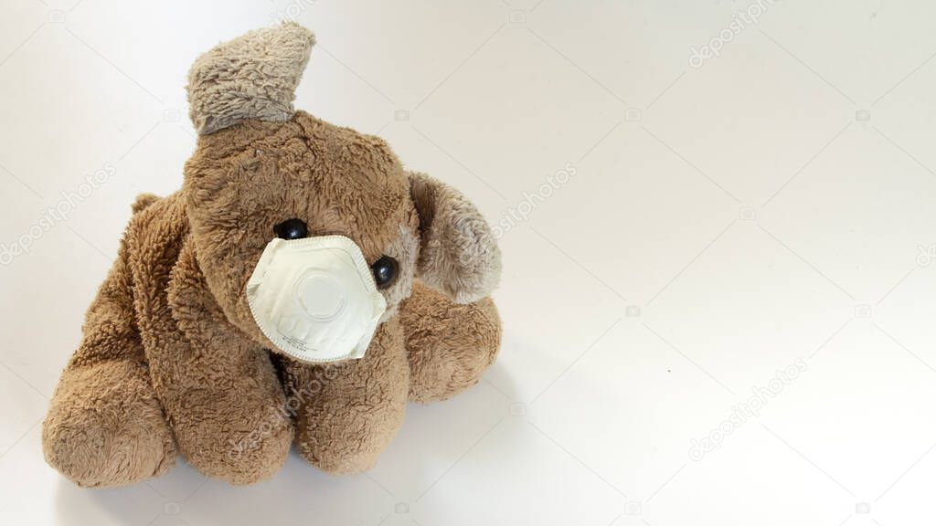 a teddy bear with a ffp2 mask, safe children's toys