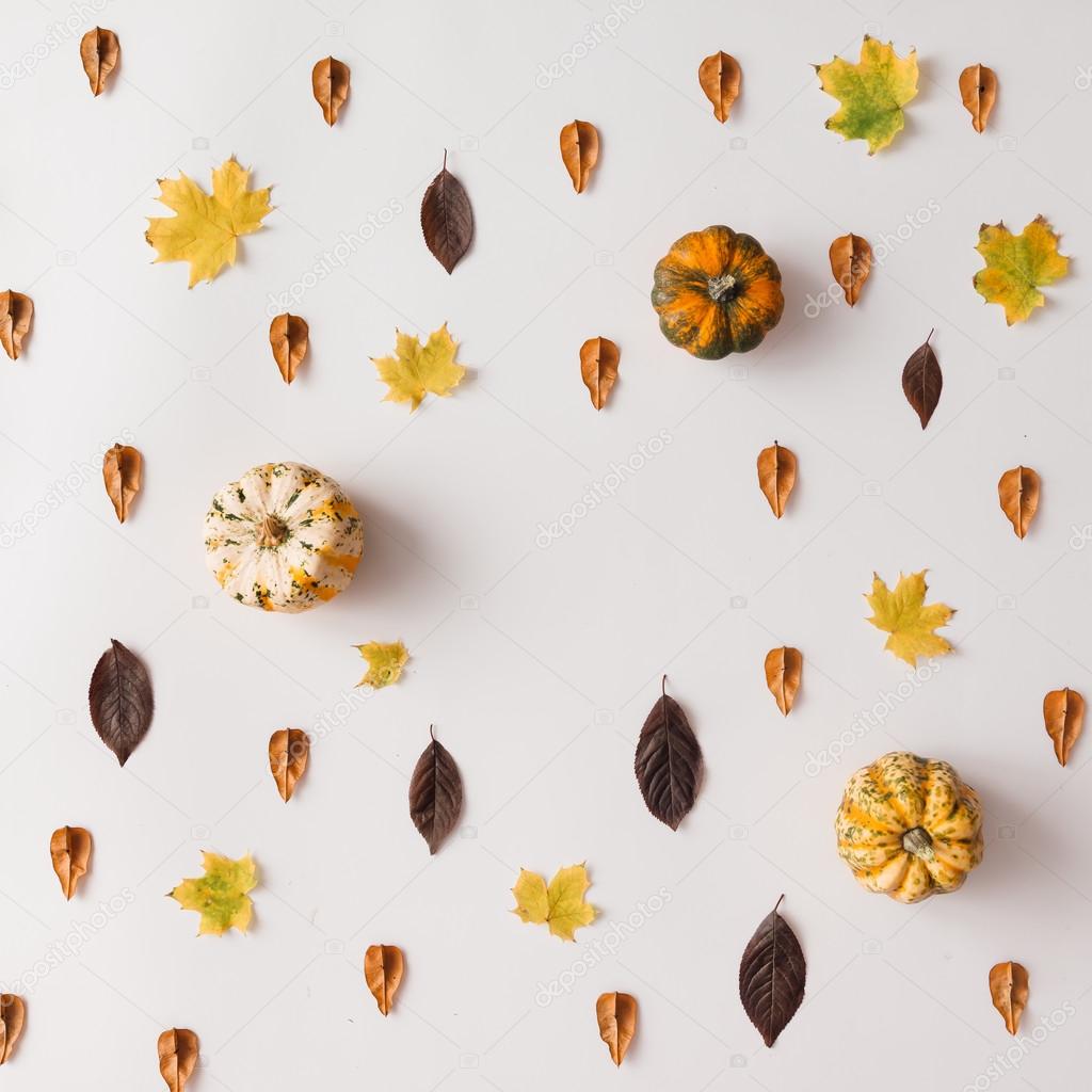 Autumn leaves pattern with pumpkins  