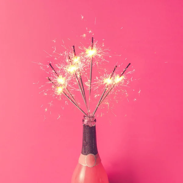 Champagne bottle with sparklers — Stock Photo, Image