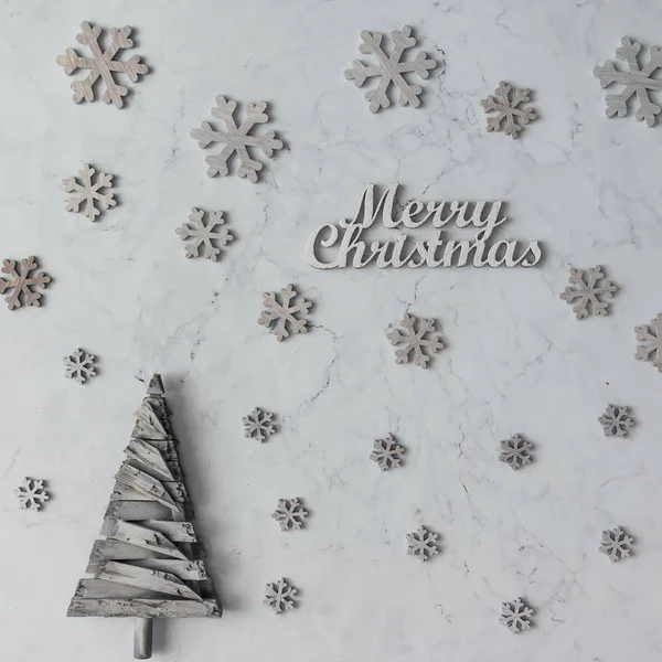 Merry Christmas inscription snowflakes and tree — Stock Photo, Image