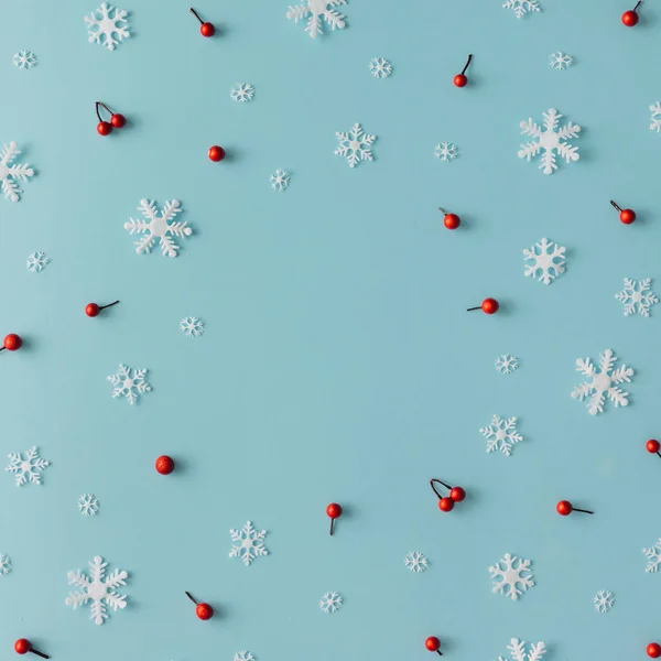 pattern made of snowflakes and red berries