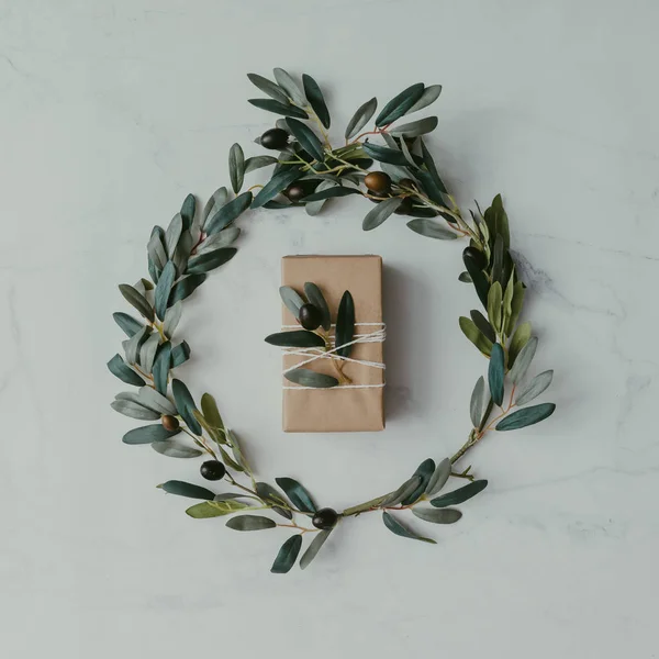 Olive branches with wrapped soap — Stock Photo, Image
