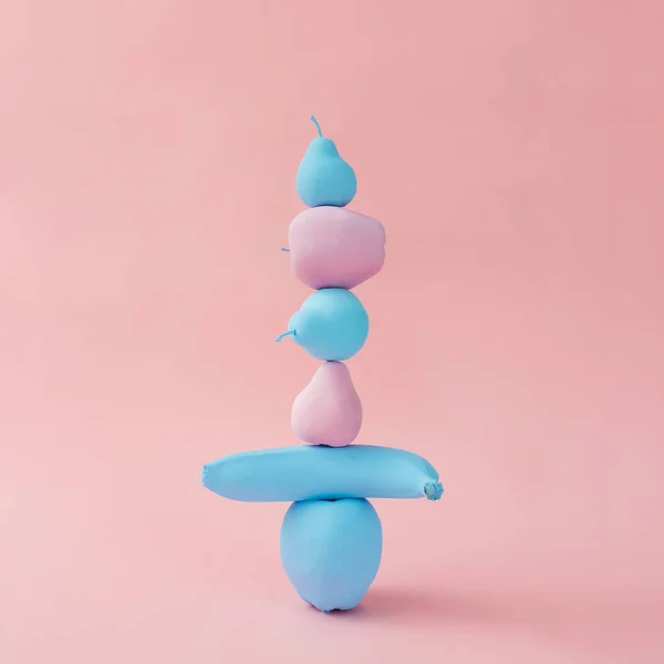 Stacked painted pink and blue fruits — Stock Photo, Image