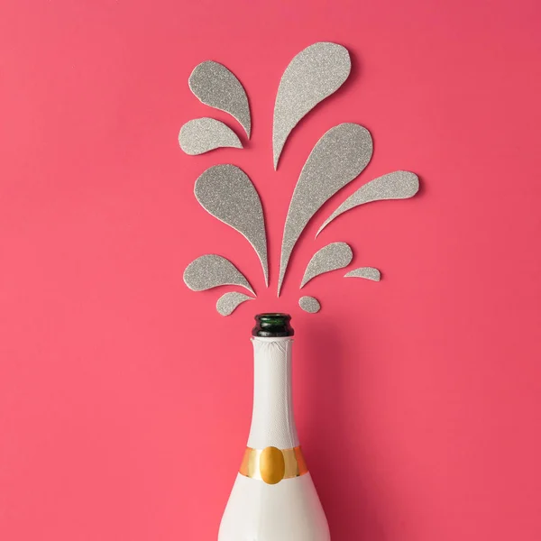 Champagne bottle with silver glittering splashes — Stock Photo, Image