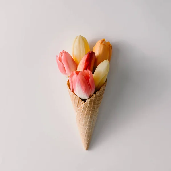 Cone with colorful tulip flowers — Stock Photo, Image