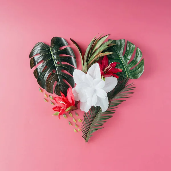 Tropical leaves and flowers in shape of heart — Stock Photo, Image