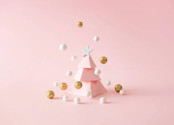 Toy Pink Christmas Tree Flying Golden White Baubles Pastel Background — Stock Photo, Image