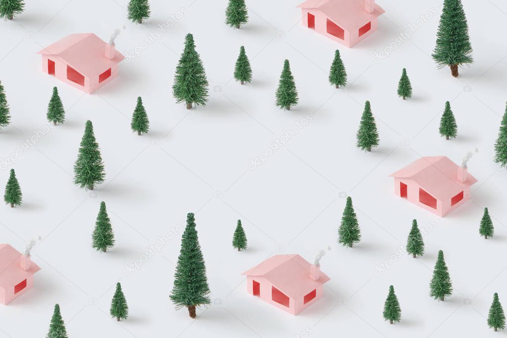 Trendy Christmas pattern made with pink houses and pine trees. Minimal winter nature concept.