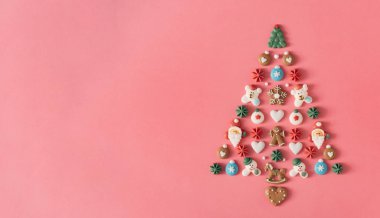 Christmas tree with sweets and cookies decoration. Creative Christmas background.