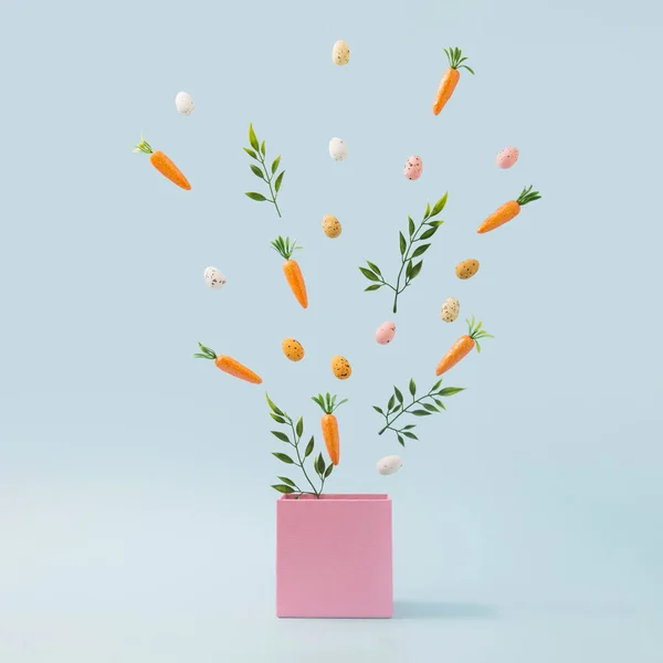 Hojas Primavera Huevos Pascua Zanahorias Que Salen Caja Rosa Concepto — Foto de Stock