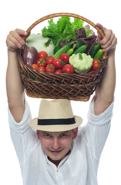 Farmer in the harvest in a basket on her head — Stock Photo, Image