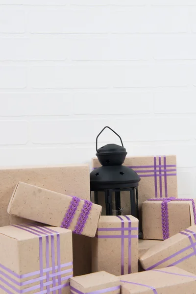 A pile of boxes on the table and in the center of the candle holder — Stock Photo, Image