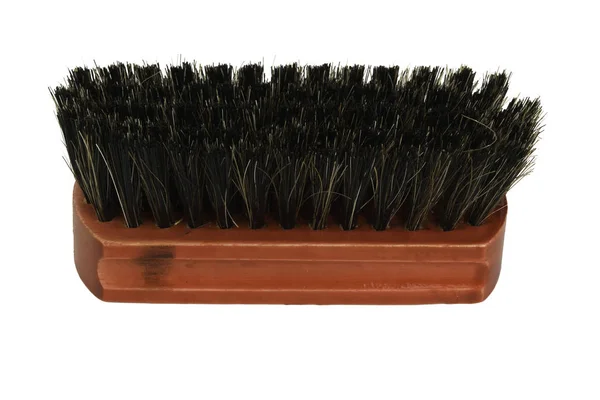 Wooden brush with black bristles on a white background — Stock Photo, Image