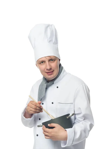 Chef-kok interfereren schotel lepel in een pot op een witte achtergrond — Stockfoto