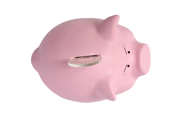 Uma grande moeda de prata não vai entrar em um banco piggy rosa — Fotografia de Stock