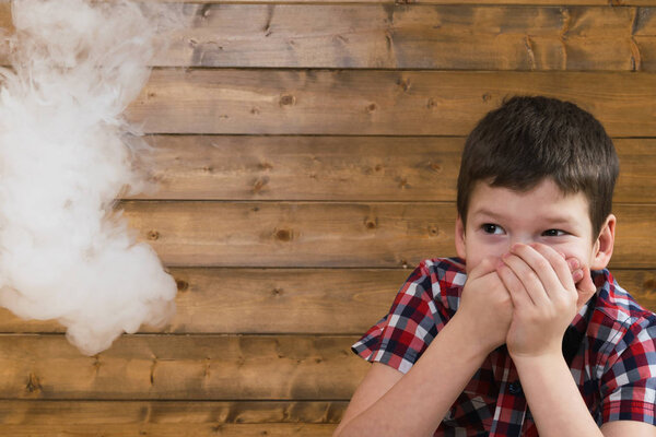boy afraid of cigarette smoke suitable to it