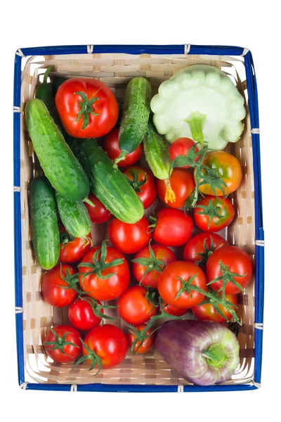 Basket with vegetables for salad on white background — Stock Photo, Image