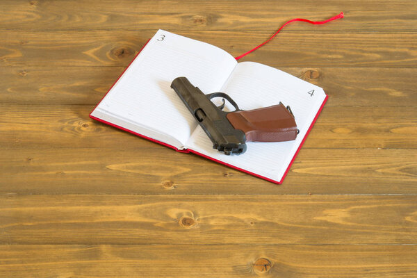 The concept of a red book and a gun, the problem of weapons in schools