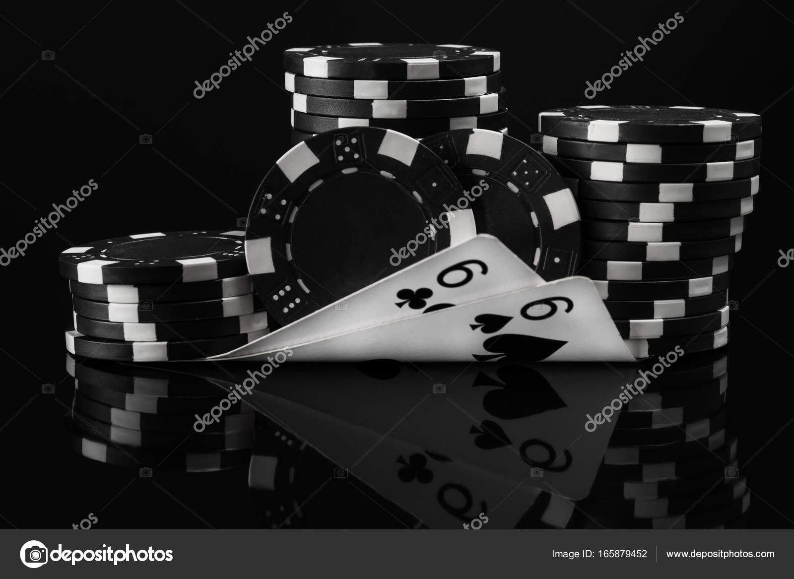 Black white idea of poker chips and poker cards in poker on a black background Stock Photo by ©kurgu128.mail.ru