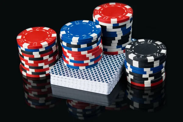 Deck of playing cards,  money with a large bank of game chips — Stock Photo, Image