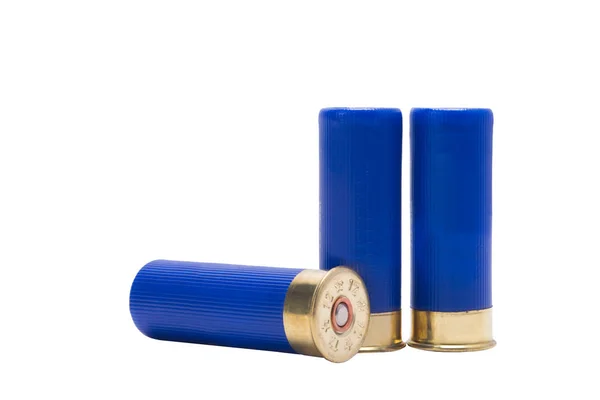 Three blue cartridges from a gun, over white background Royalty Free Stock Images