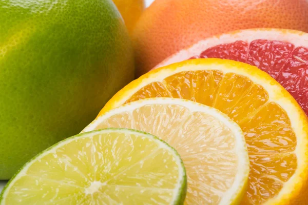 Set of sliced citrus fruits lie together as a background Stock Photo