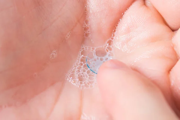 contact lens to improve vision, in the palm of your hand