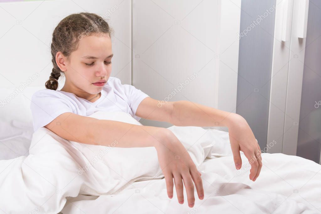 girl, suffering from sleepwalking, gets out of bed