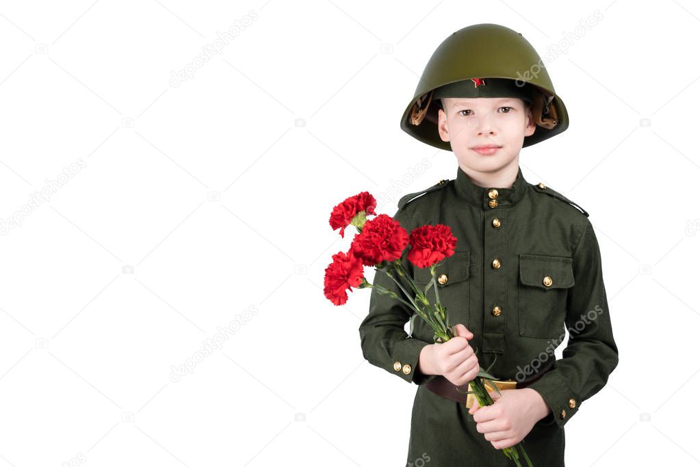 boy in a helmet wearing a military uniform and holding red flowers close-up, isolated on white