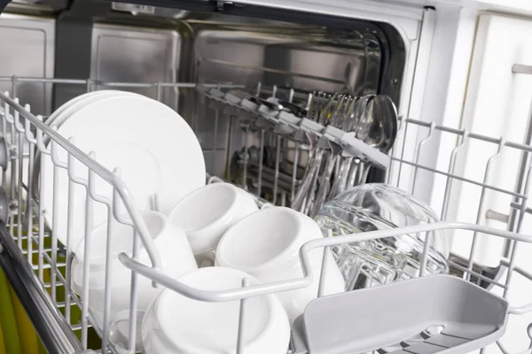 Basket Pulled Out Dishwasher Clean White Dishes Cutlery Close — Stock Photo, Image
