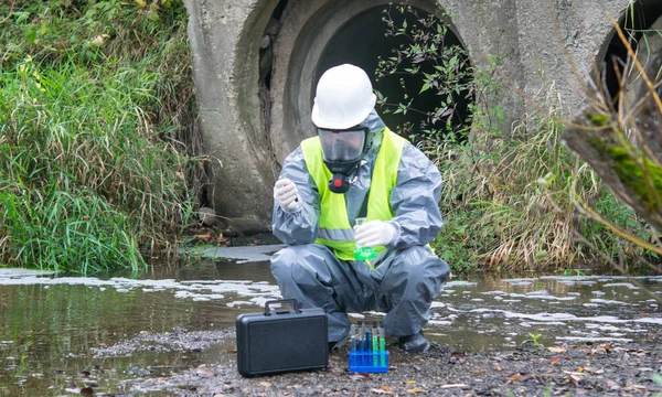 Scientist Protective Suit Mask Takes Liquid River Test Tubes Sample — Stock Photo, Image