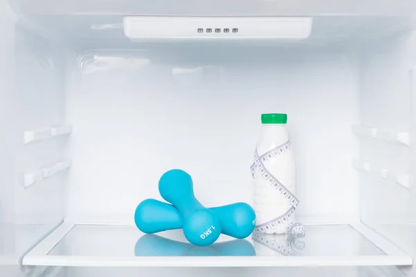 Blue Dumbbells Milk Bottle Shelf Refrigerator Diet Fitness Concept — Stock Photo, Image